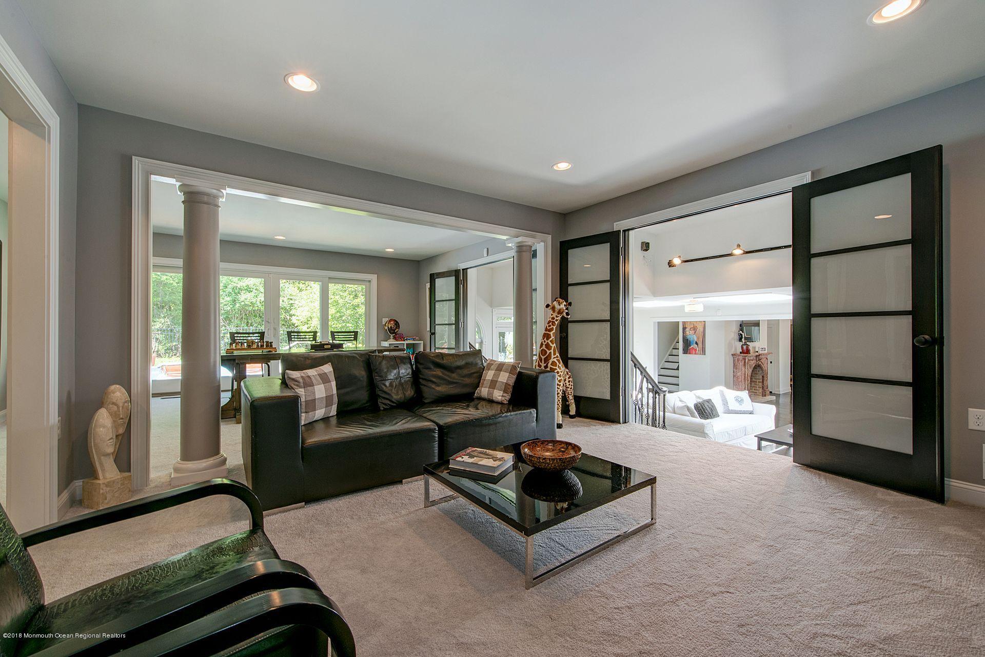 75 Seven Bridges Road Little Silver, NJ 07739 - Photo 8 of 43 a living room with furniture and a large window
