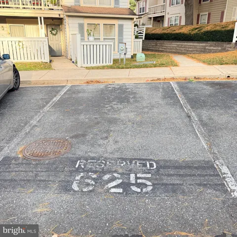 a view of a parked cars in front of a house