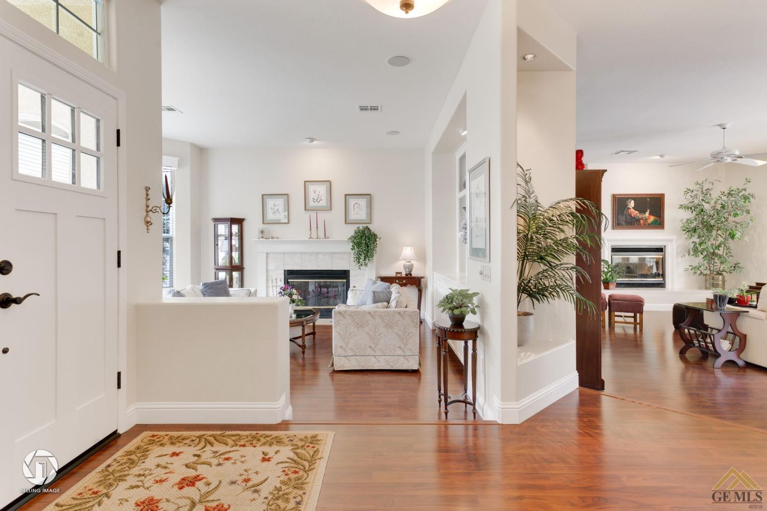 Undisclosed Address Bakersfield, CA 93311 - Photo 11 of 51 a living room with furniture and a fireplace