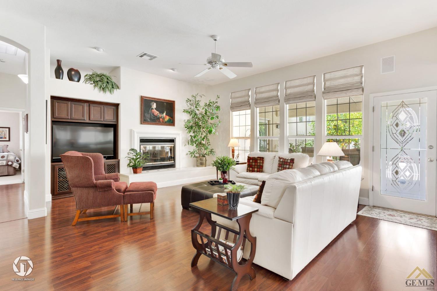 Undisclosed Address Bakersfield, CA 93311 - Photo 14 of 51 a living room with fireplace furniture and a large window