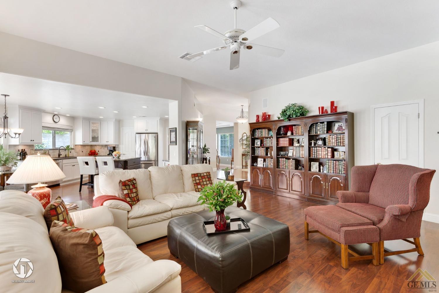 Undisclosed Address Bakersfield, CA 93311 - Photo 17 of 51 a living room with furniture kitchen view and a chandelier