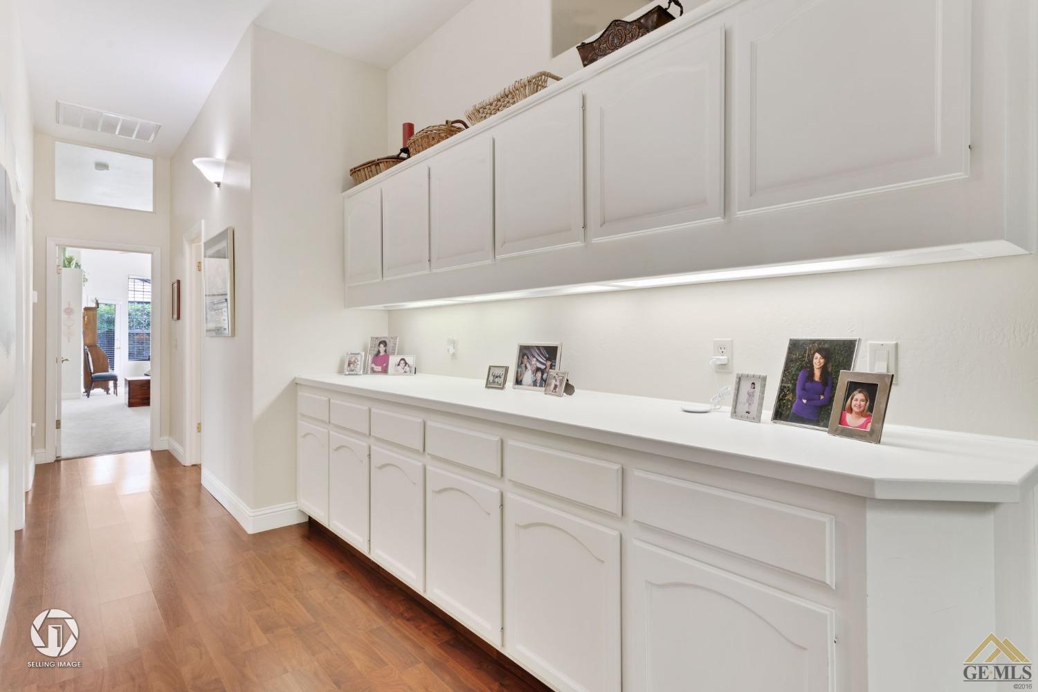 Undisclosed Address Bakersfield, CA 93311 - Photo 27 of 51 a kitchen with white cabinets and sink