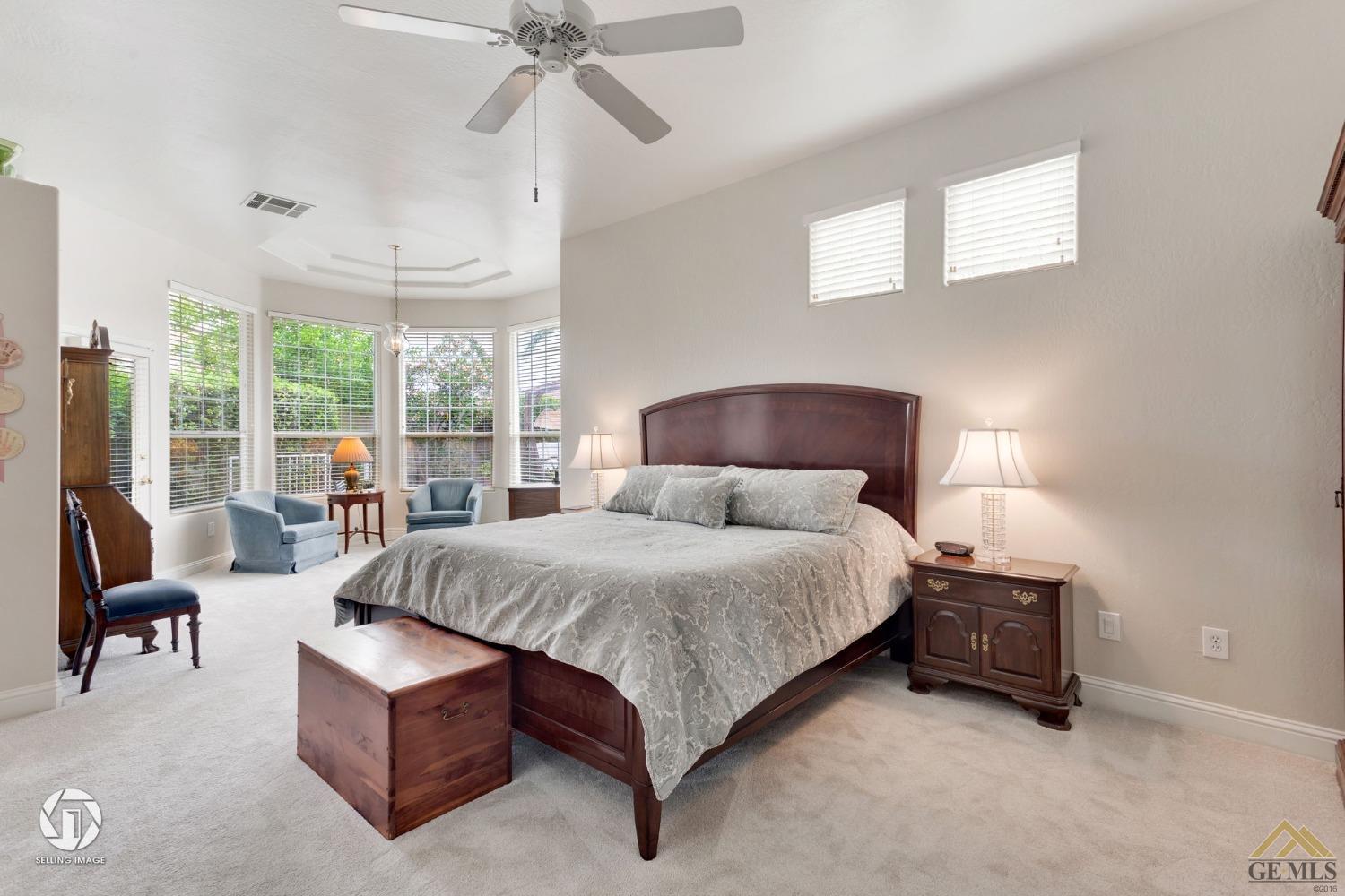 Undisclosed Address Bakersfield, CA 93311 - Photo 28 of 51 a spacious bedroom with a bed and large windows