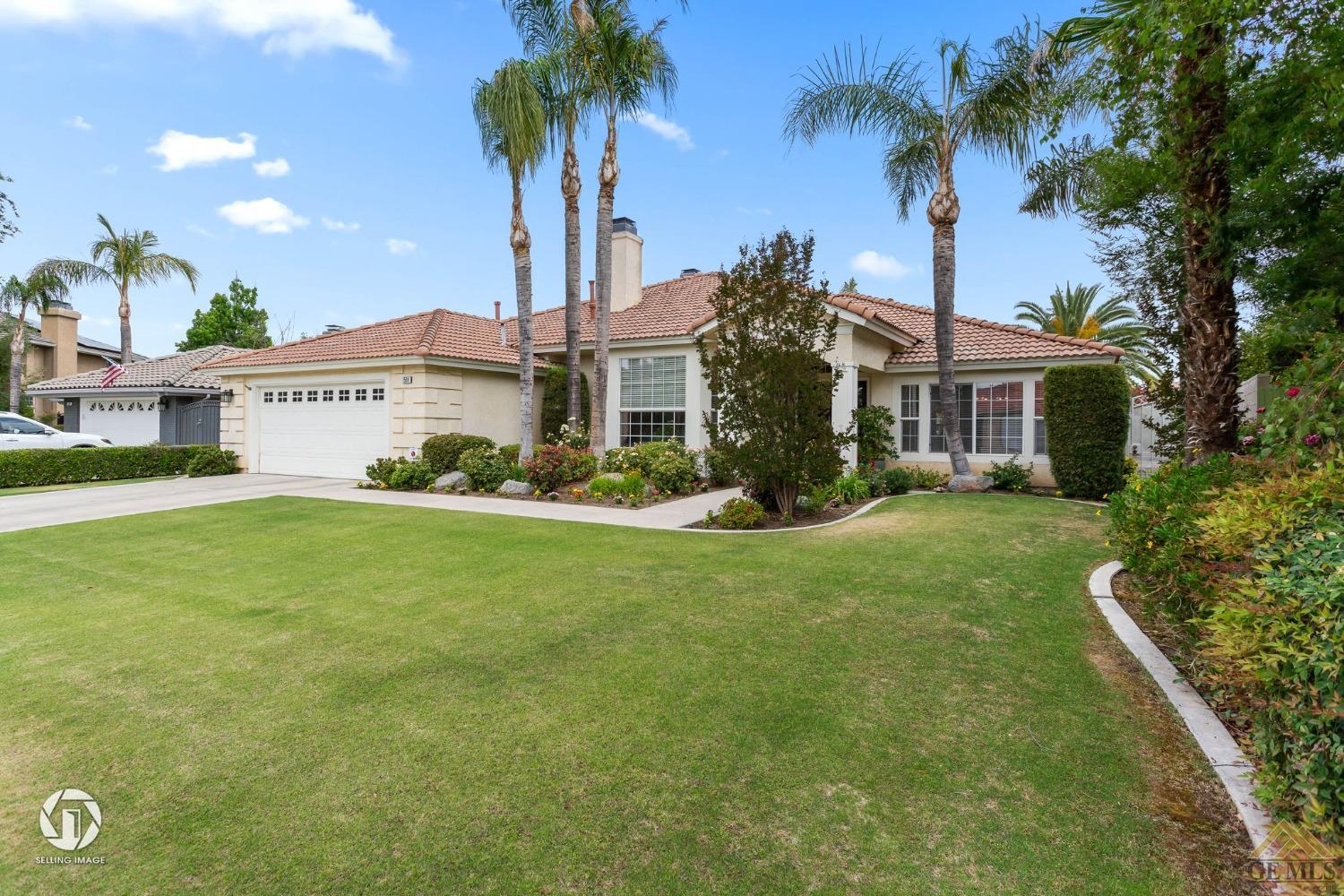 Undisclosed Address Bakersfield, CA 93311 - Photo 3 of 51 a front view of a house with garden