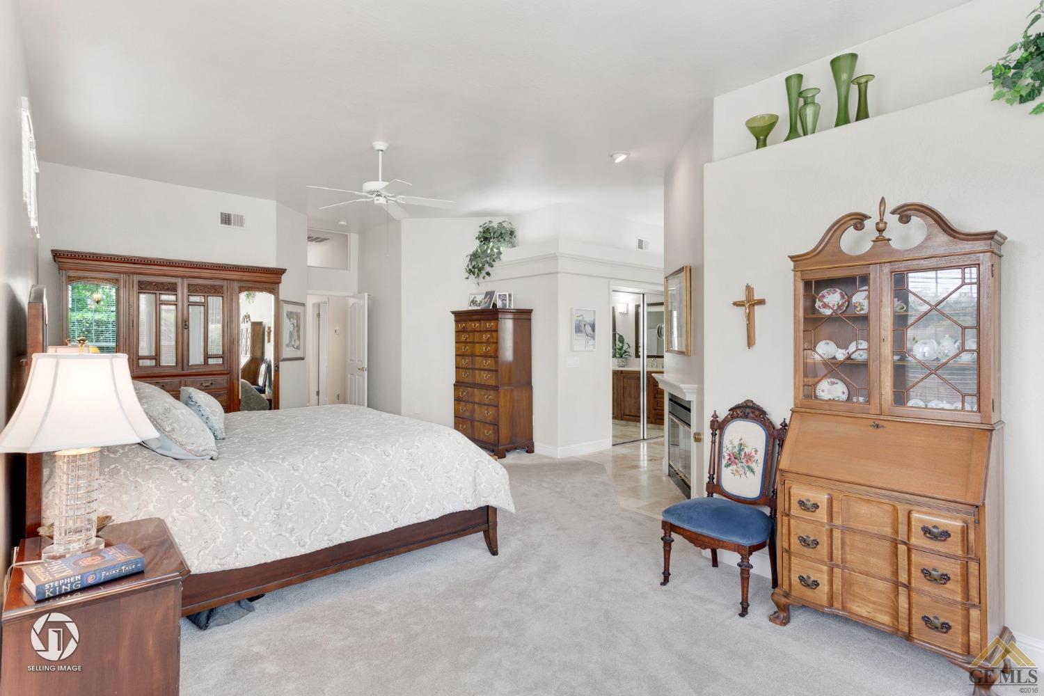 Undisclosed Address Bakersfield, CA 93311 - Photo 31 of 51 a bed room with a bed and a lamp