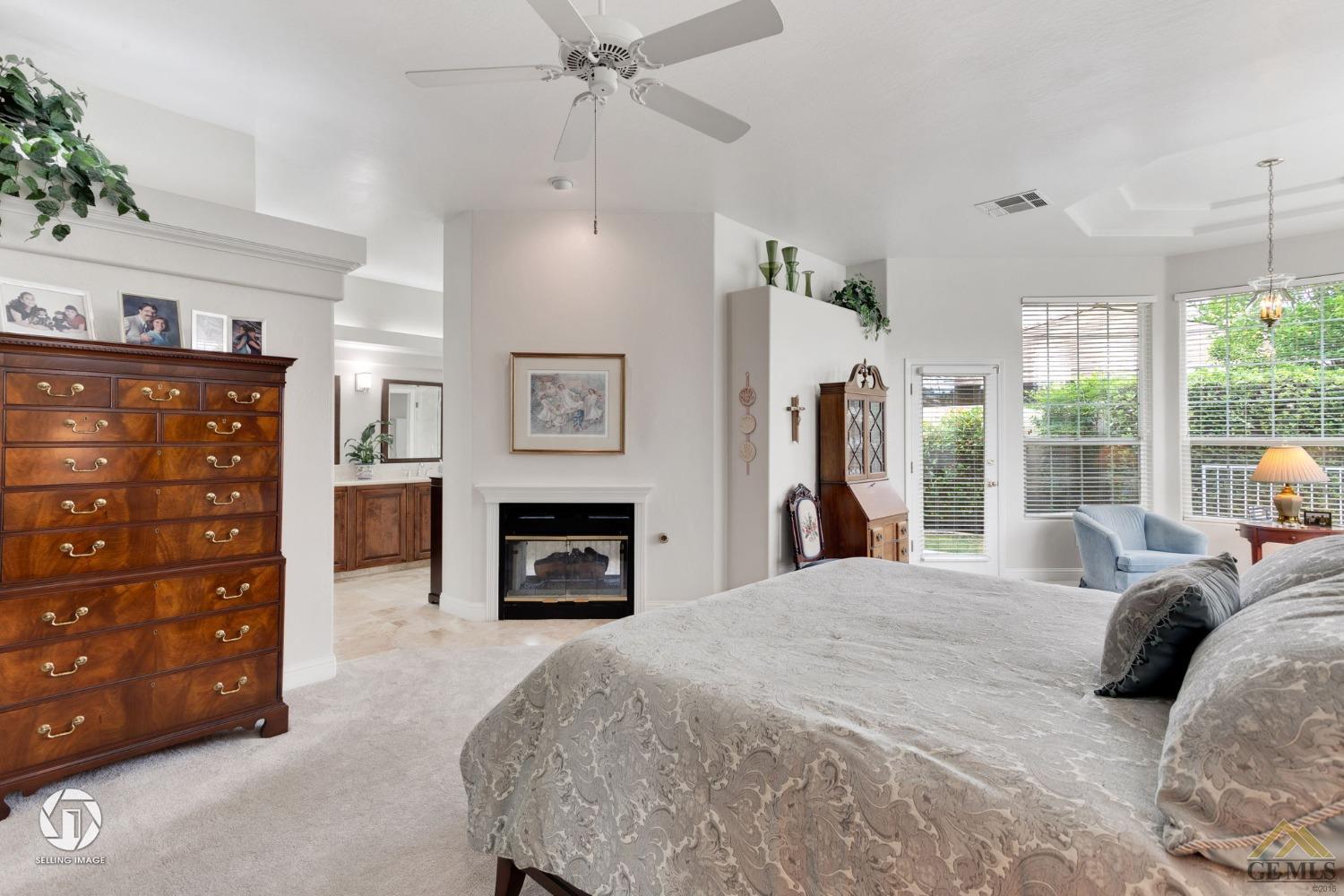 Undisclosed Address Bakersfield, CA 93311 - Photo 32 of 51 a bedroom with a bed and a mirror