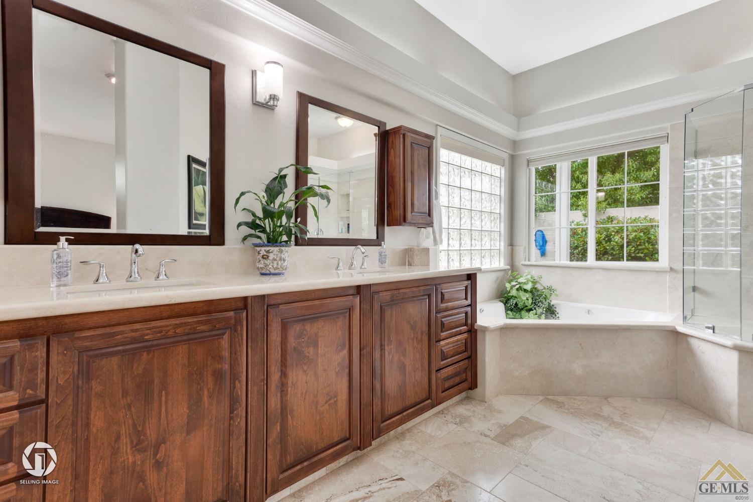 Undisclosed Address Bakersfield, CA 93311 - Photo 33 of 51 a bathroom with a granite countertop bathtub sink and mirror