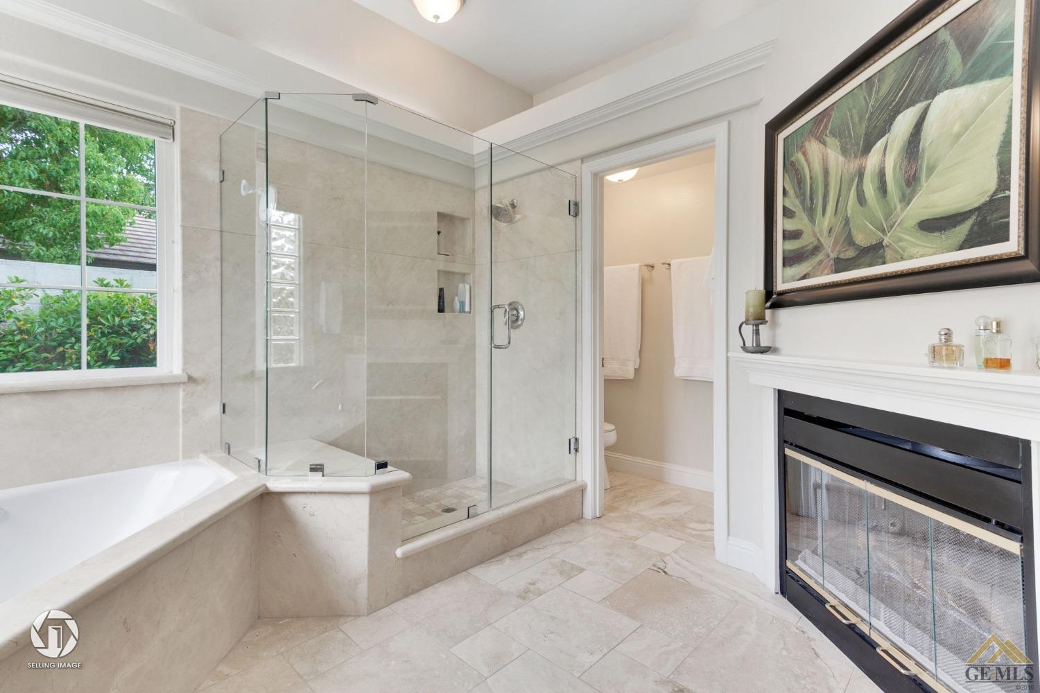 Undisclosed Address Bakersfield, CA 93311 - Photo 34 of 51 a bathroom with a tub shower sink and mirror