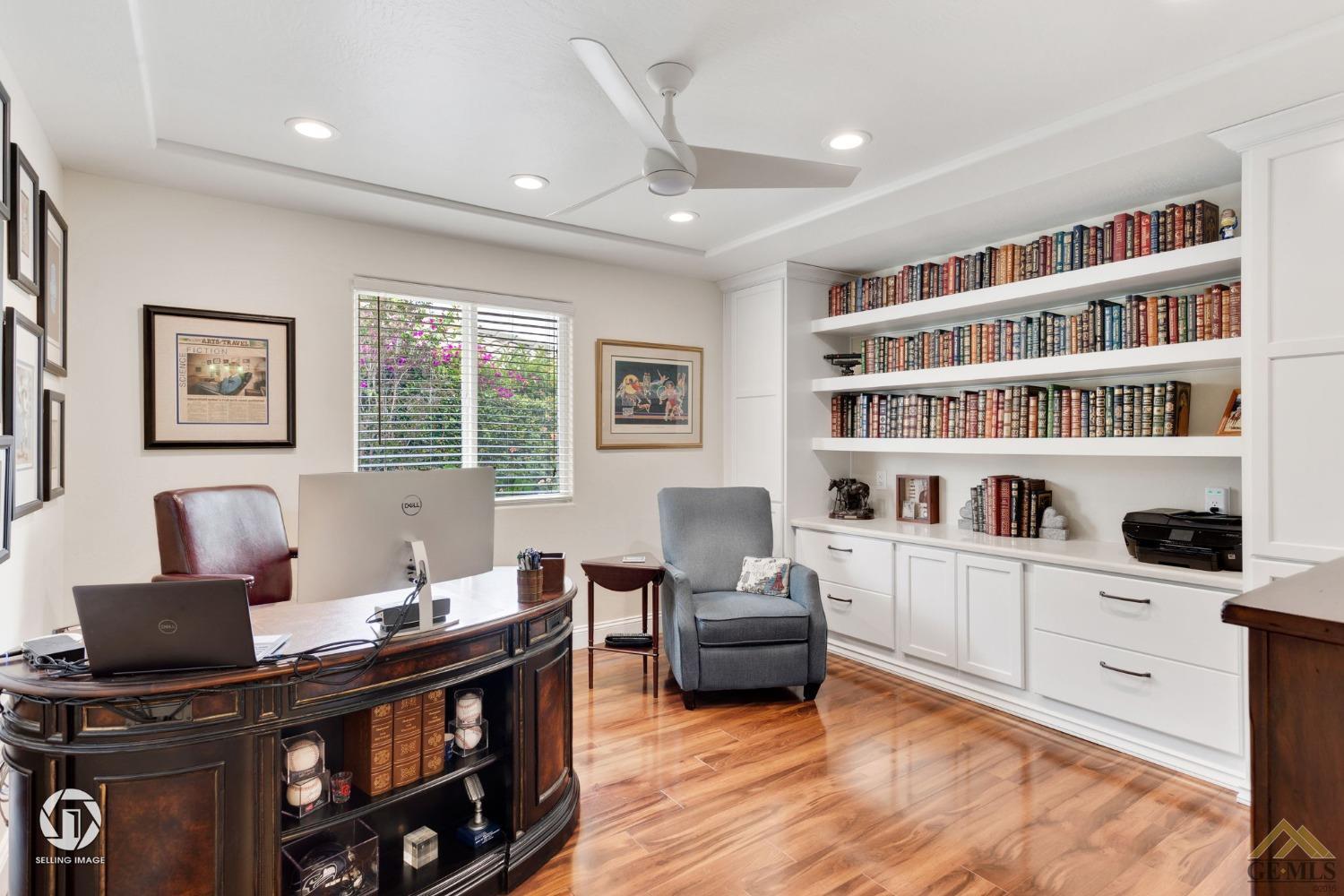 Undisclosed Address Bakersfield, CA 93311 - Photo 35 of 51 a living room with furniture cabinets and a flat screen tv