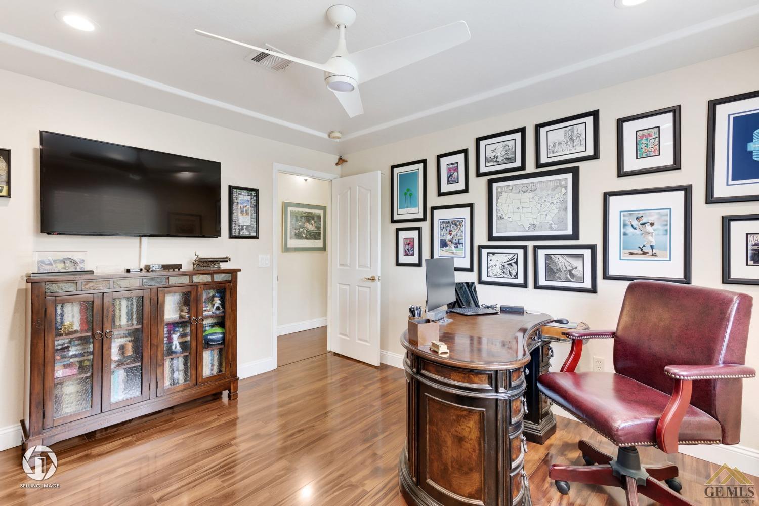 Undisclosed Address Bakersfield, CA 93311 - Photo 36 of 51 a living room with furniture and a flat screen tv