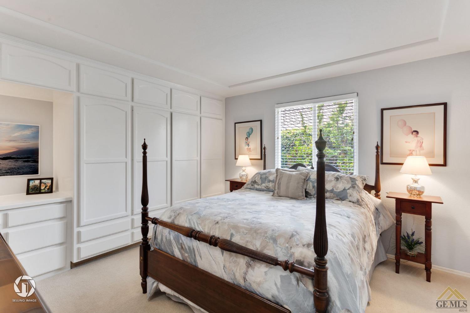 Undisclosed Address Bakersfield, CA 93311 - Photo 39 of 51 a bedroom with a bed and large windows