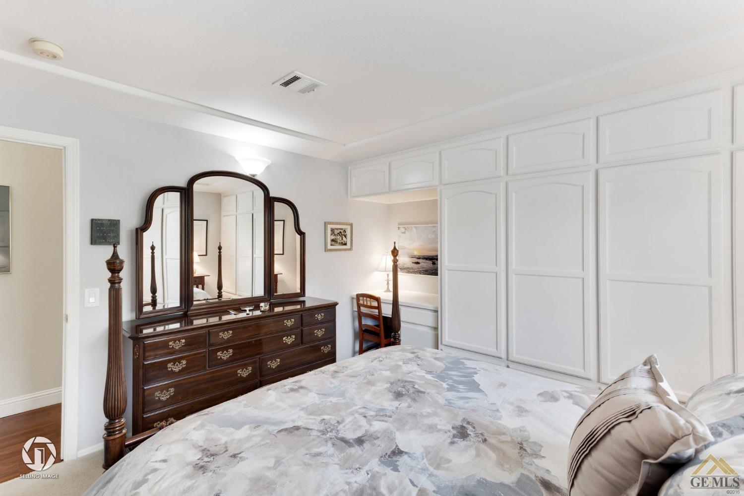 Undisclosed Address Bakersfield, CA 93311 - Photo 40 of 51 a bedroom with a bed and a dresser