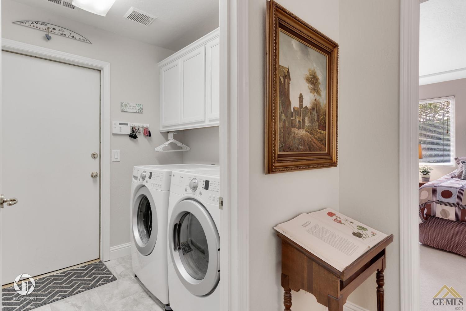 Undisclosed Address Bakersfield, CA 93311 - Photo 44 of 51 a view of kitchen with washer and dryer