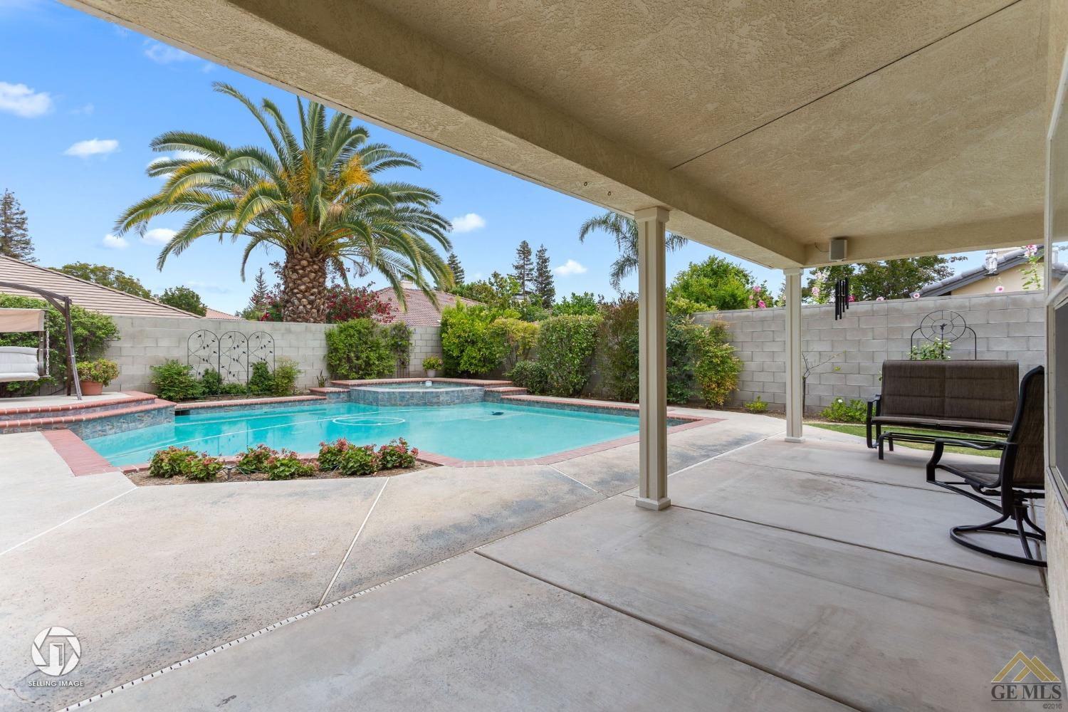 Undisclosed Address Bakersfield, CA 93311 - Photo 45 of 51 a view of a backyard with couches under palm trees