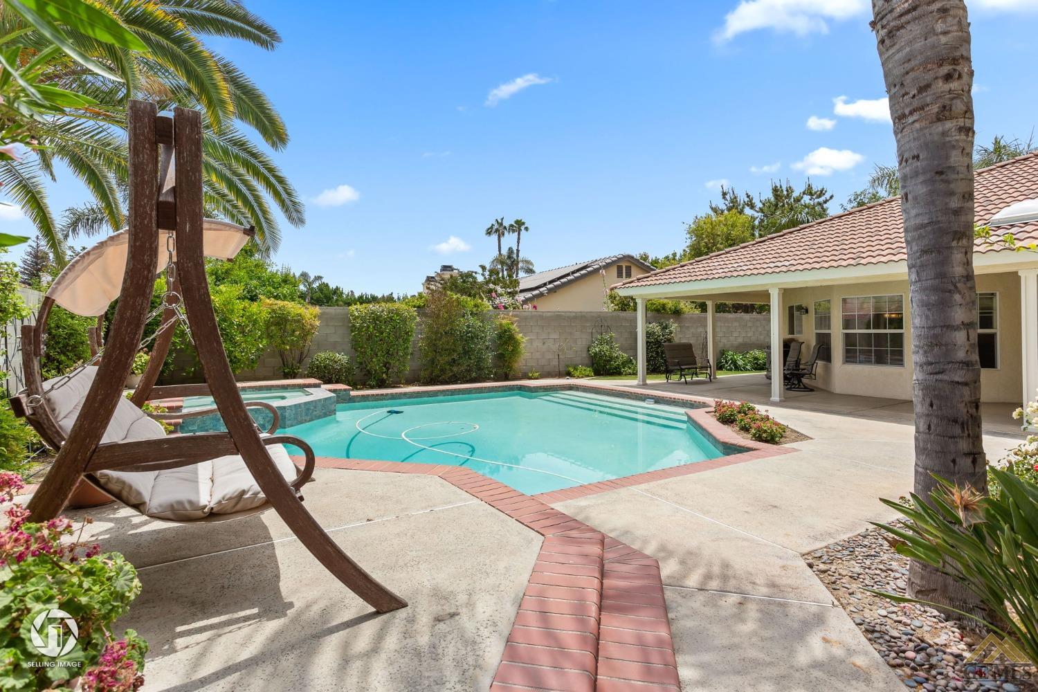 Undisclosed Address Bakersfield, CA 93311 - Photo 49 of 51 a view of a house with pool and sitting area