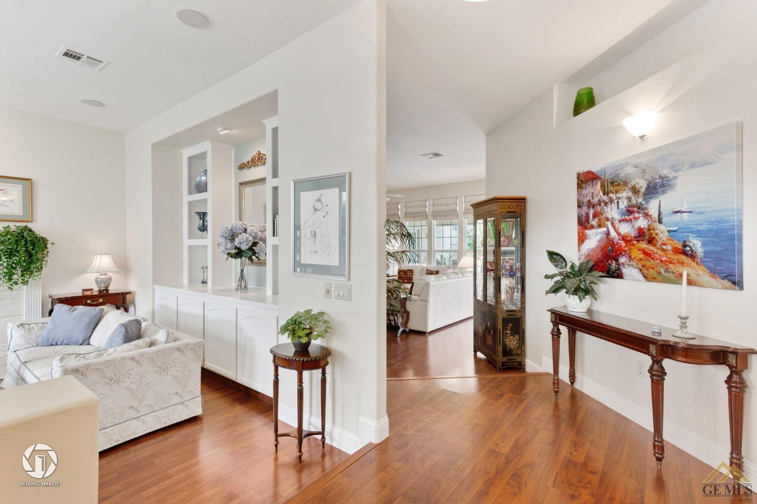 Undisclosed Address Bakersfield, CA 93311 - Photo 8 of 51 a living room with furniture and a flat screen tv