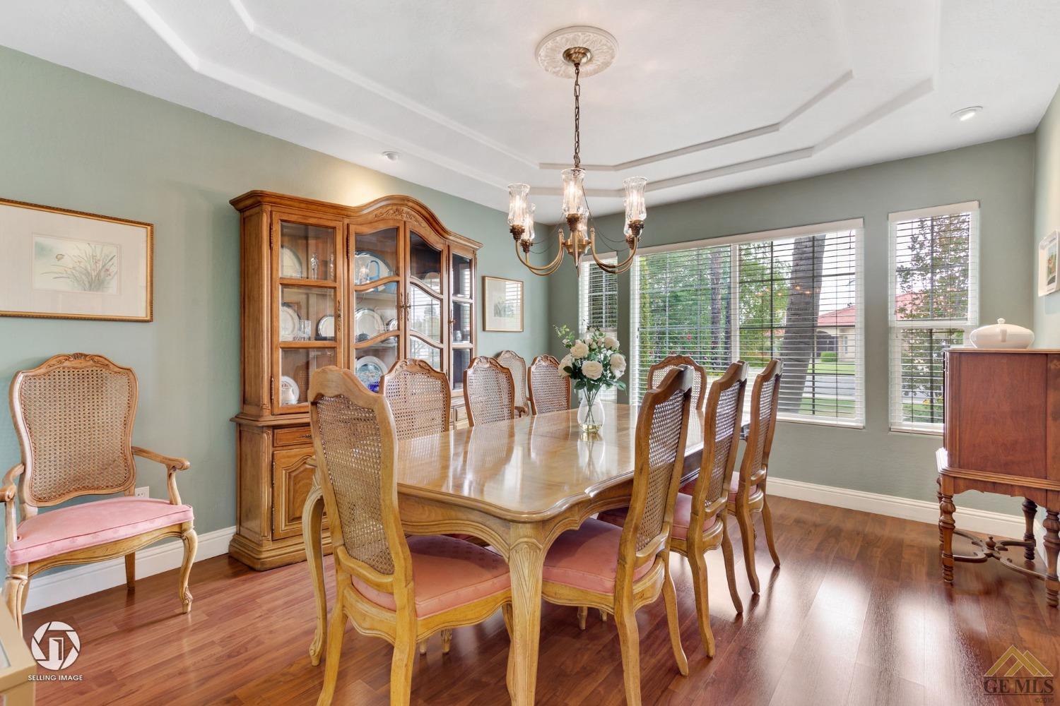 Undisclosed Address Bakersfield, CA 93311 - Photo 9 of 51 a view of a dining room with furniture window and wooden floor