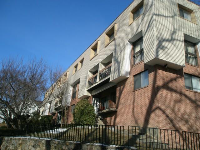 1 Valley Road, Unit 203 Stamford, CT 06902 - Photo 1 of 1 a view of a building with backyard and deck