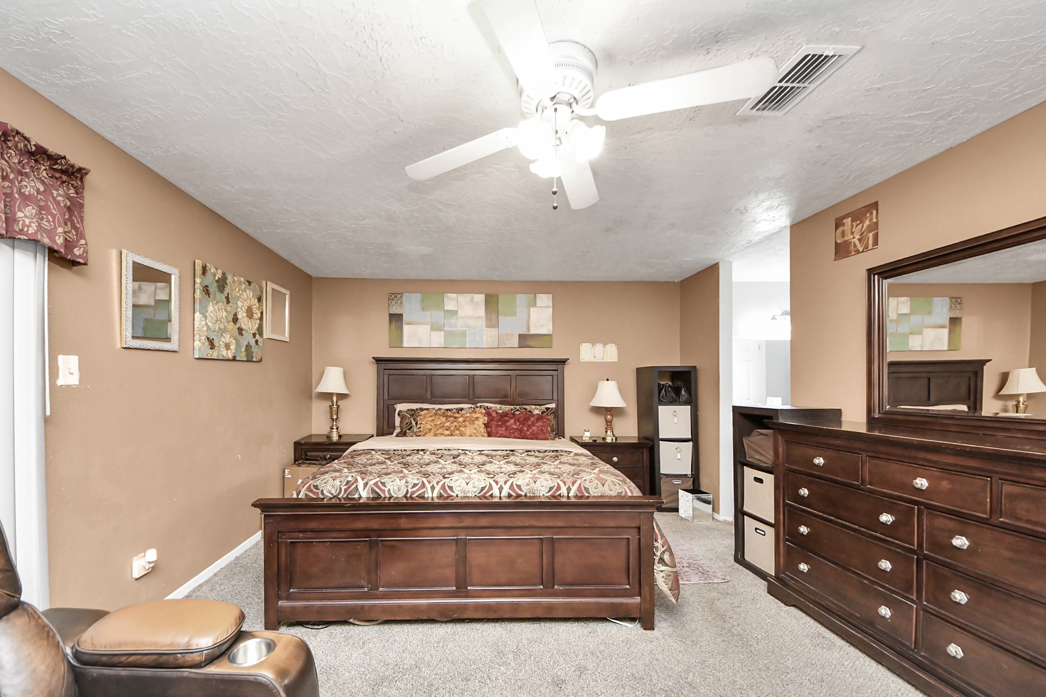 4155 Amir Street Houston, TX 77072 - Photo 37 of 43 a bedroom with a bed and a dresser
