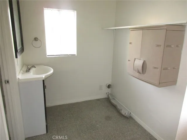 a bathroom with a sink and mirror