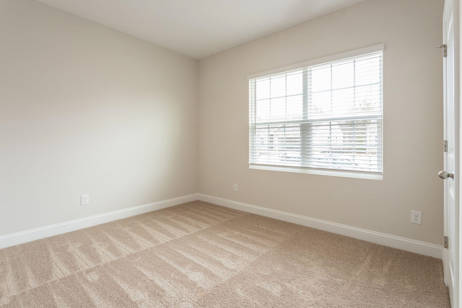 40 Symmetry Loop Youngsville, NC 27596 - Photo 13 of 17 an empty room with a window
