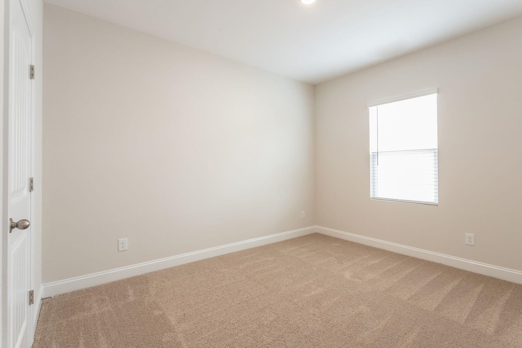 40 Symmetry Loop Youngsville, NC 27596 - Photo 15 of 17 an empty room with a window