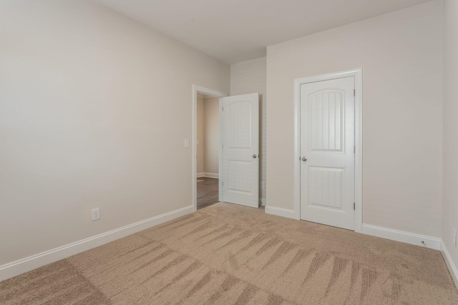 40 Symmetry Loop Youngsville, NC 27596 - Photo 16 of 17 a view of a room with an empty space