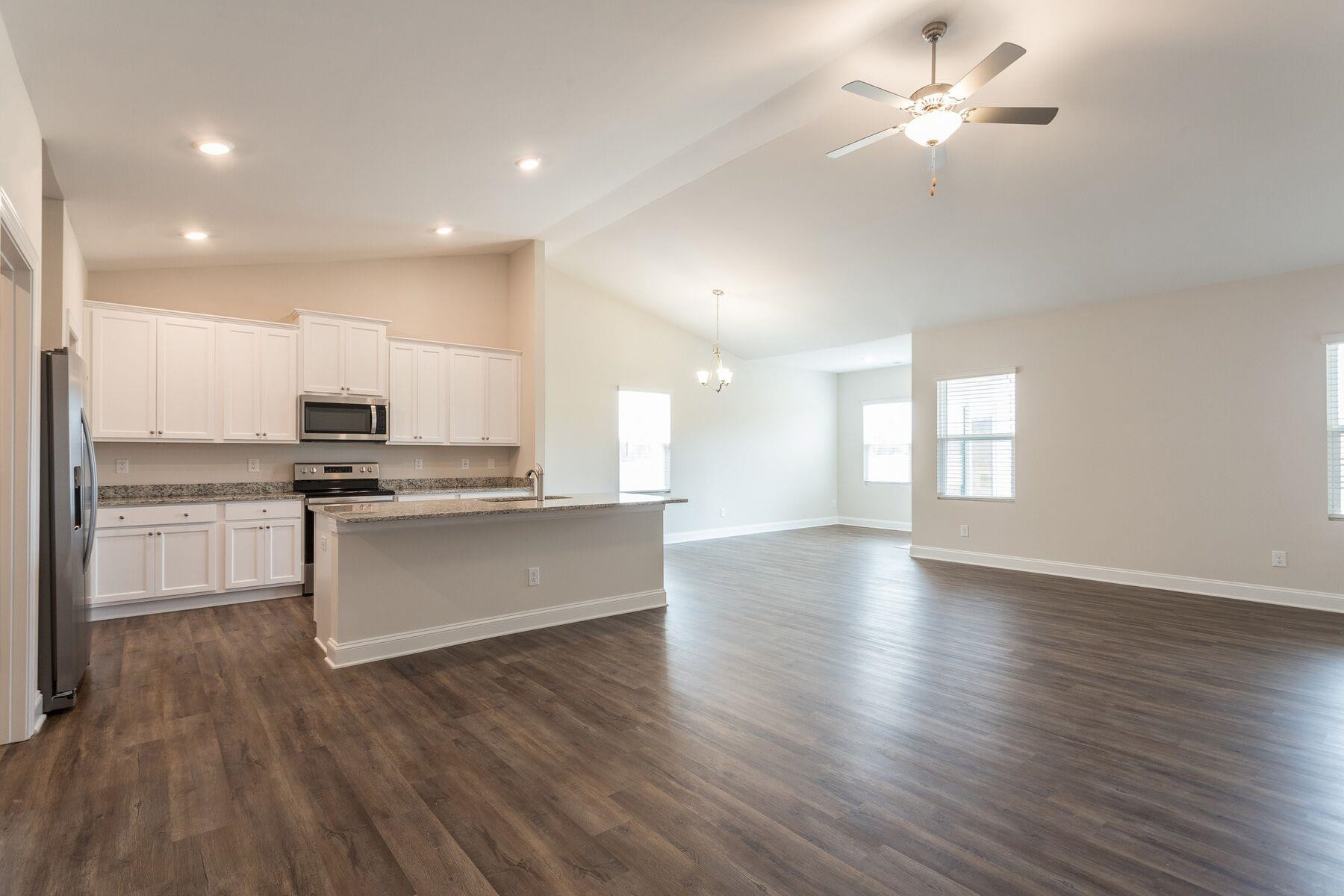 40 Symmetry Loop Youngsville, NC 27596 - Photo 3 of 17 a view of kitchen with sink and wooden floor