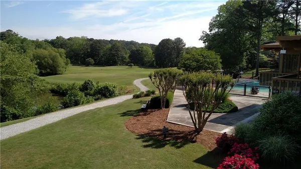 a view of a backyard with sitting area