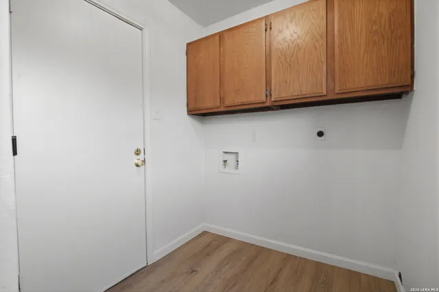 a view of cabinets and wooden floor