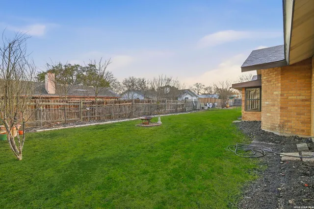 a view of a yard with an outdoor seating