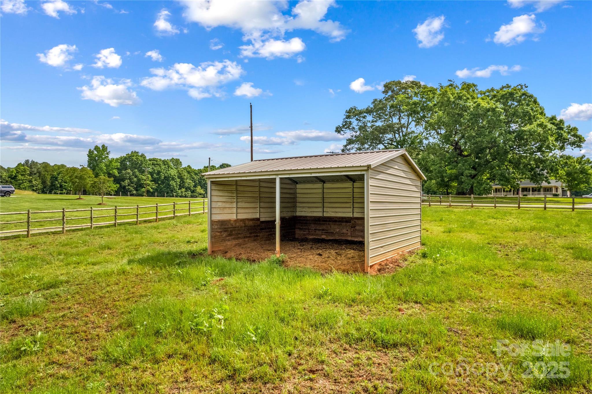 296 Hicks Creek Road Troutman, NC 28166 - Photo 37 of 48 a view of a backyard with barn