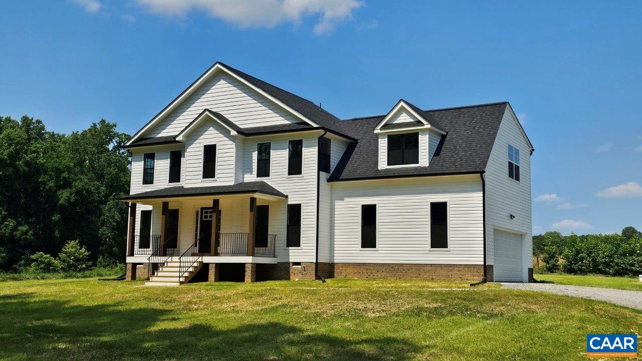 1740 Hunters Lodge Road Palmyra, VA 22963 - Photo 2 of 32 a front view of a house with a yard