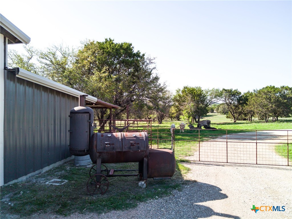 690 A County Road 4707 Kempner, TX 76539 - Photo 35 of 39 a view of a backyard with wooden fence and a bench