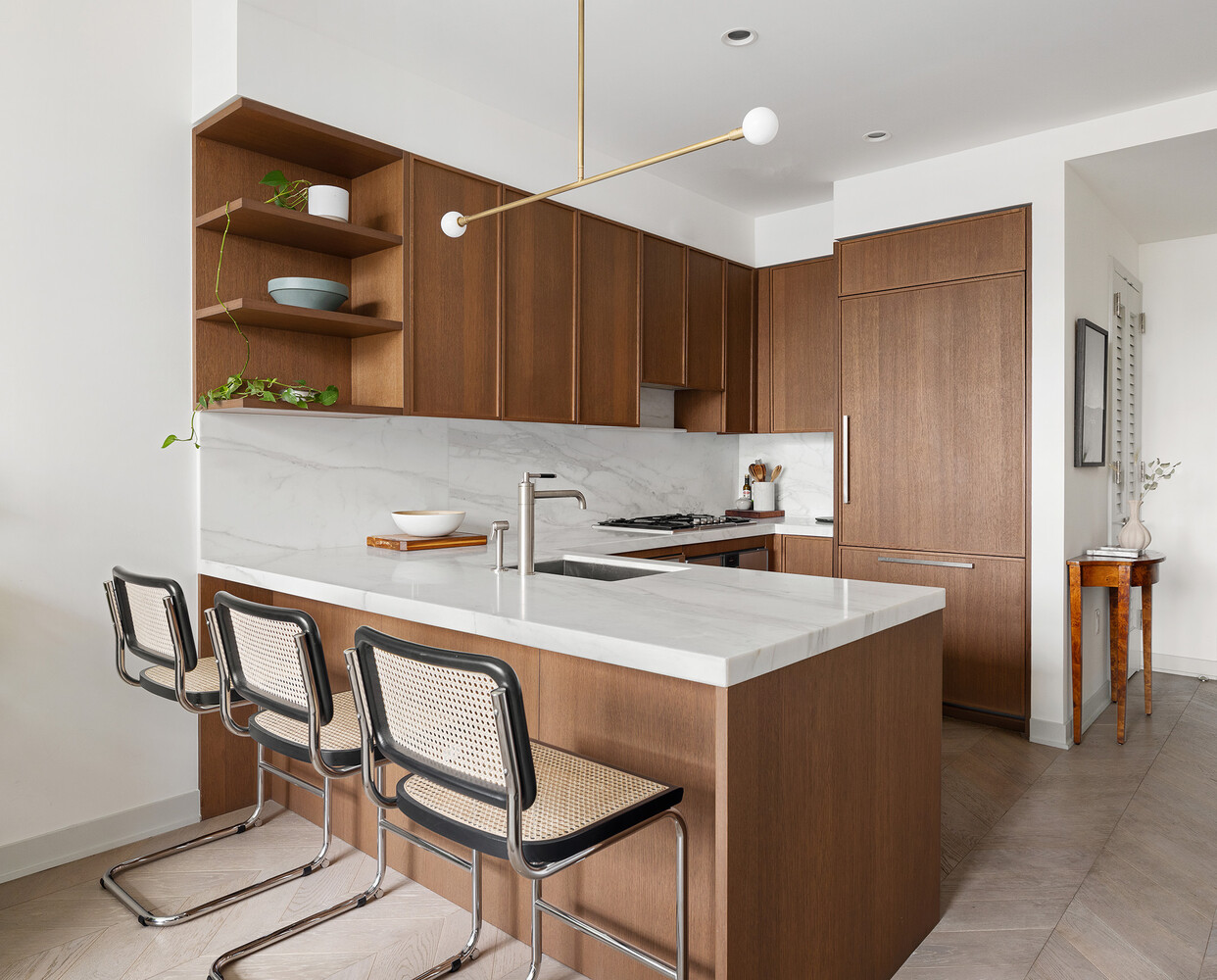 180 Front Street, Unit 9K Brooklyn, NY 11201 - Photo 5 of 15 a kitchen with a table chairs sink and cabinets