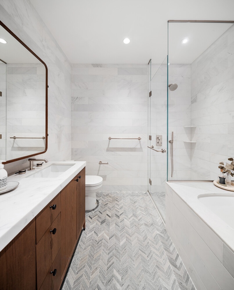 180 Front Street, Unit 9K Brooklyn, NY 11201 - Photo 7 of 15 a spacious bathroom with a sink a toilet a mirror and shower