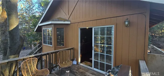 a balcony view with a seating space