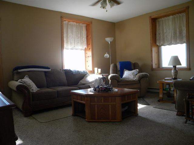 7789 North Coon Road Dakota, IL 61018 - Photo 6 of 10 a living room with furniture a window and a chandelier