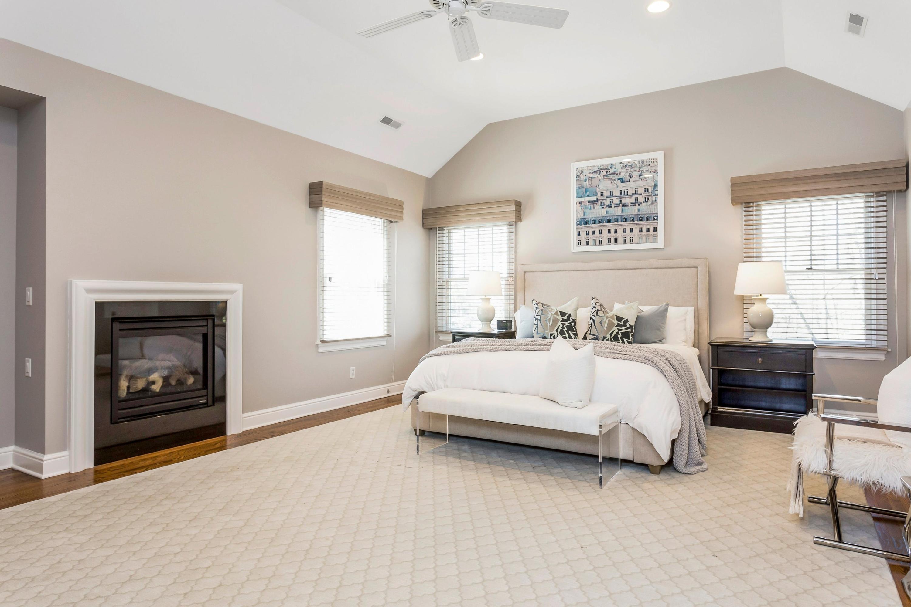 33 Briar Brae Road Darien, CT 06820 - Photo 15 of 37 a spacious bedroom with a bed and a fireplace