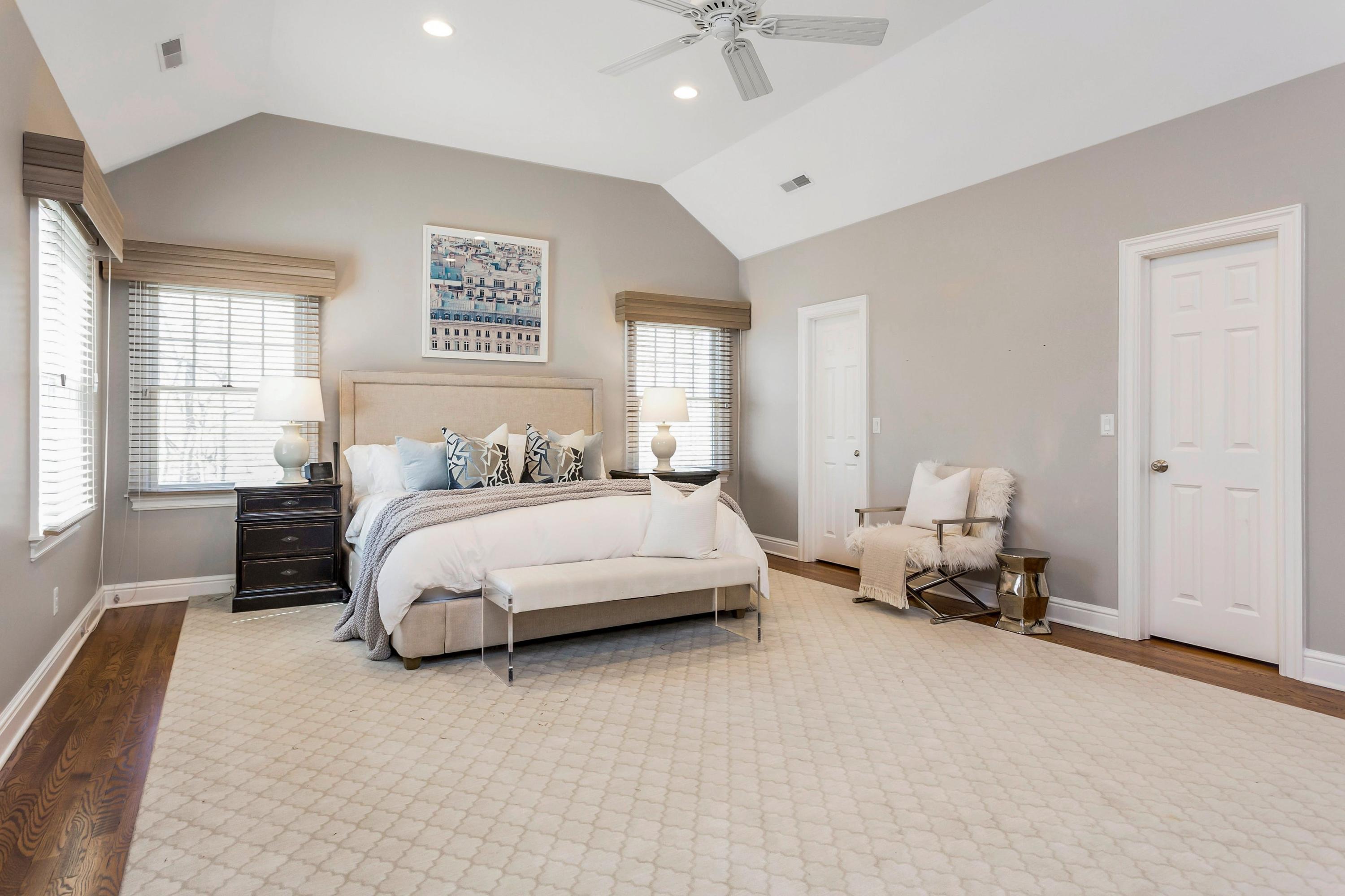 33 Briar Brae Road Darien, CT 06820 - Photo 16 of 37 a bedroom with a bed and a chandelier