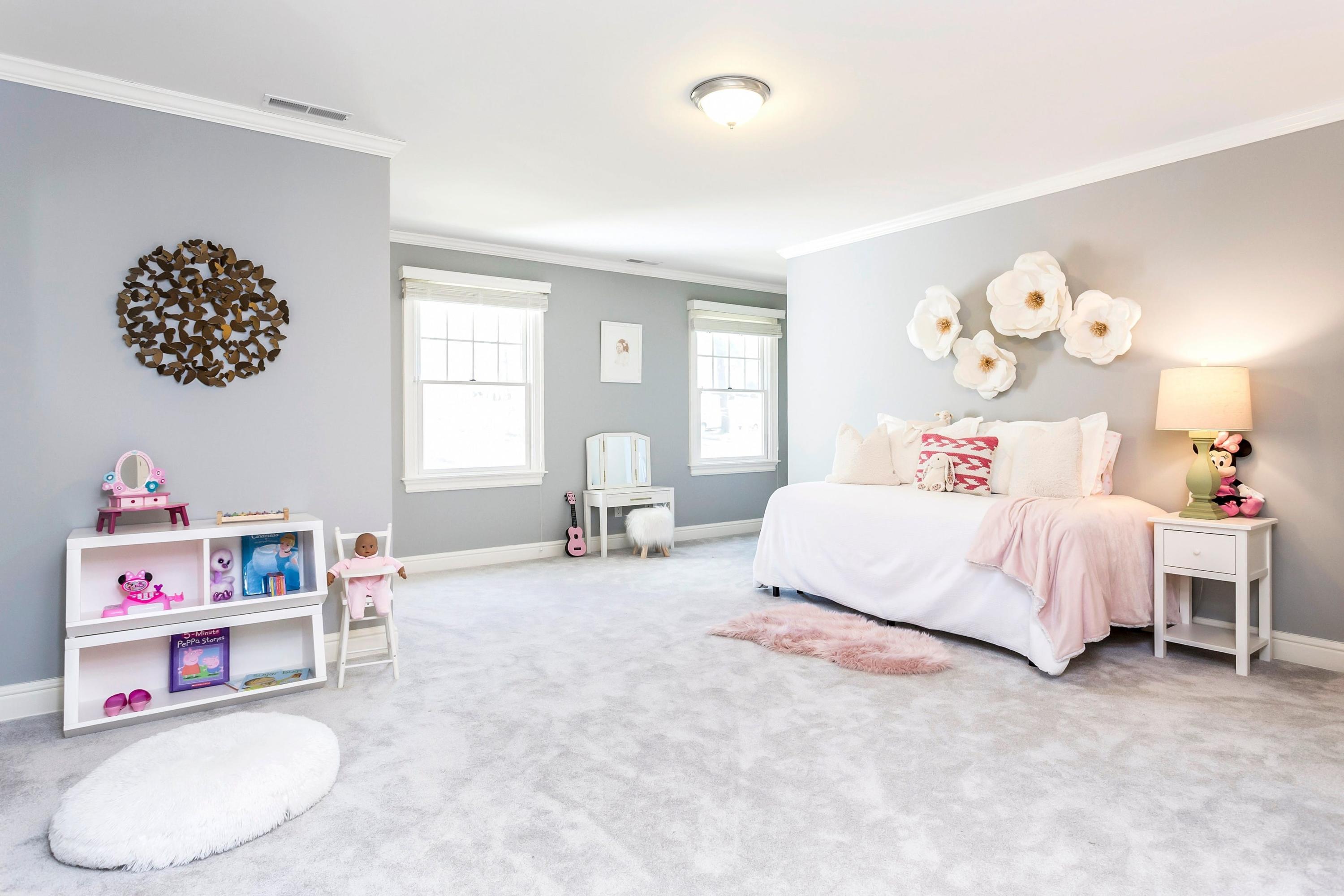 33 Briar Brae Road Darien, CT 06820 - Photo 19 of 37 a bedroom with a bed and a cabinets