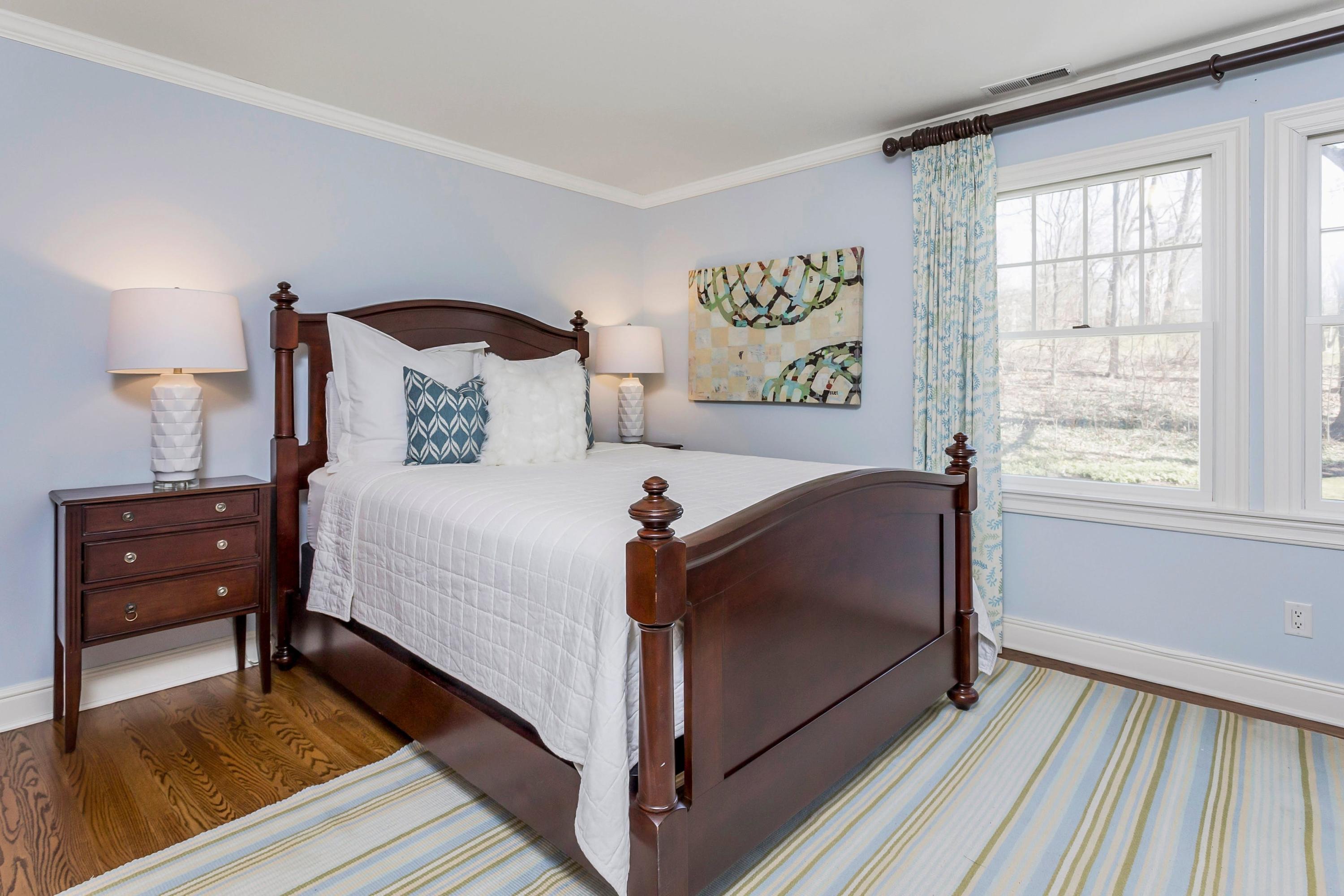 33 Briar Brae Road Darien, CT 06820 - Photo 21 of 37 a bed room with a bed and a lamp