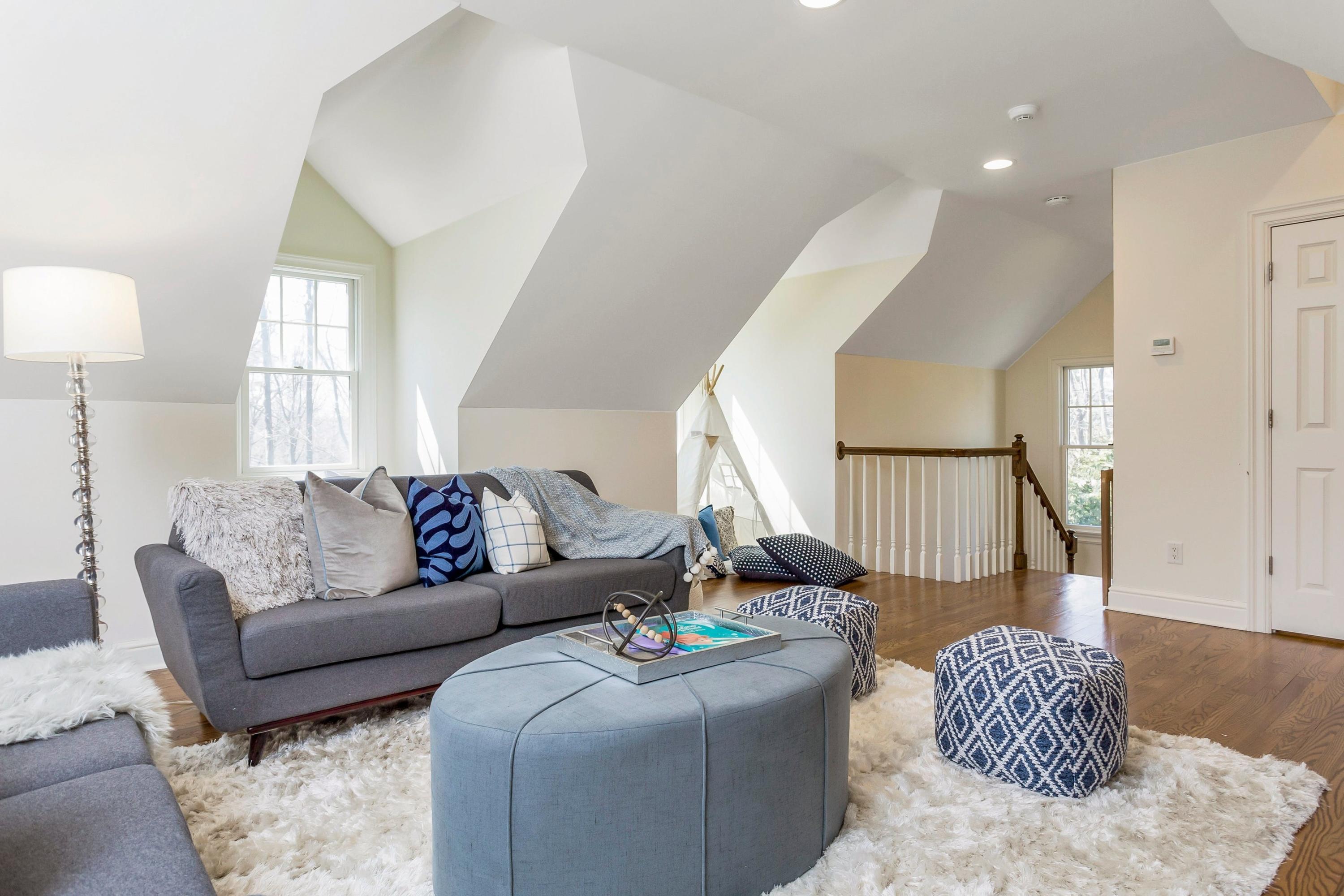 33 Briar Brae Road Darien, CT 06820 - Photo 22 of 37 a living room with furniture and a large window
