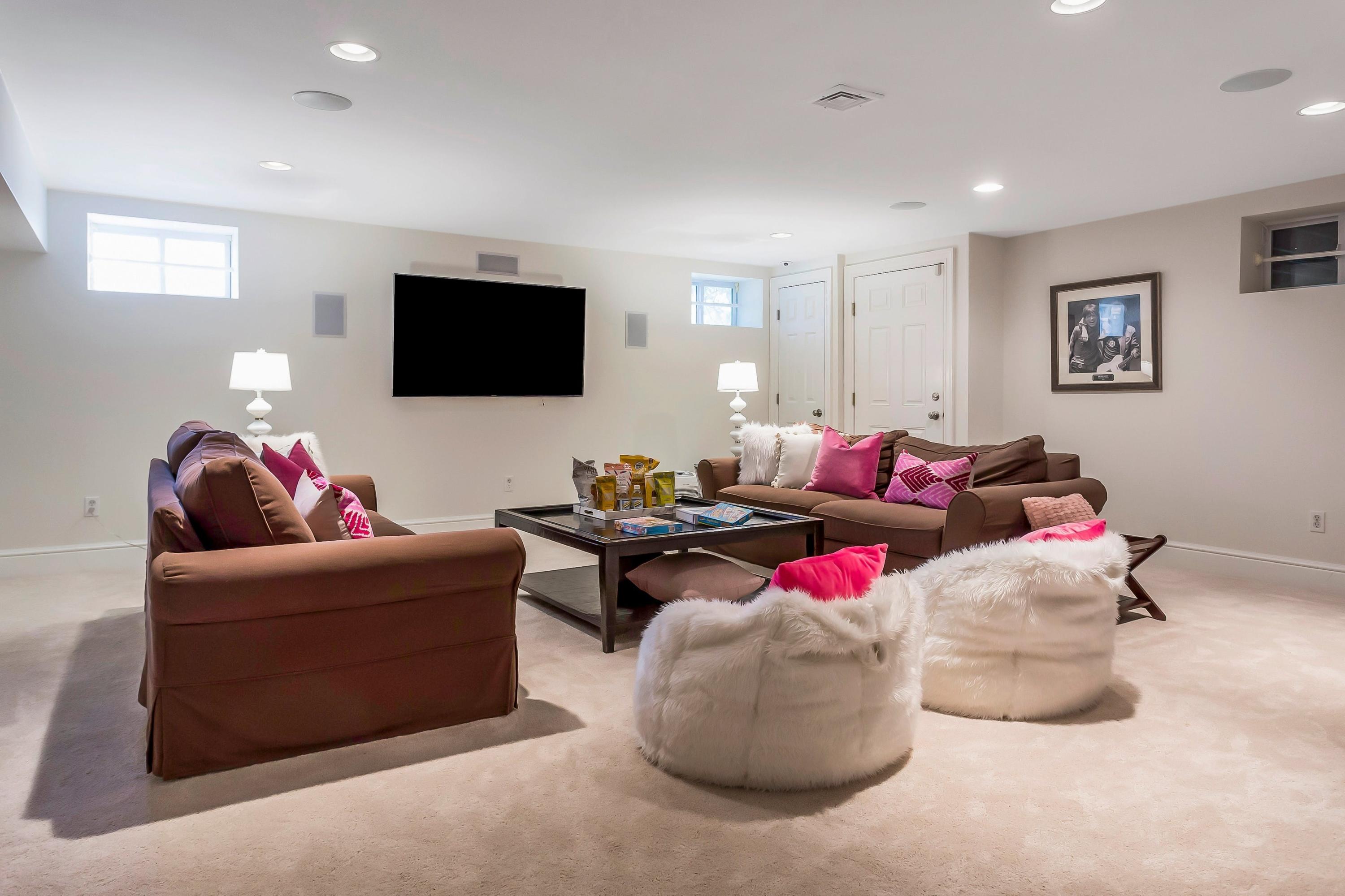 33 Briar Brae Road Darien, CT 06820 - Photo 28 of 37 a living room with furniture and a flat screen tv