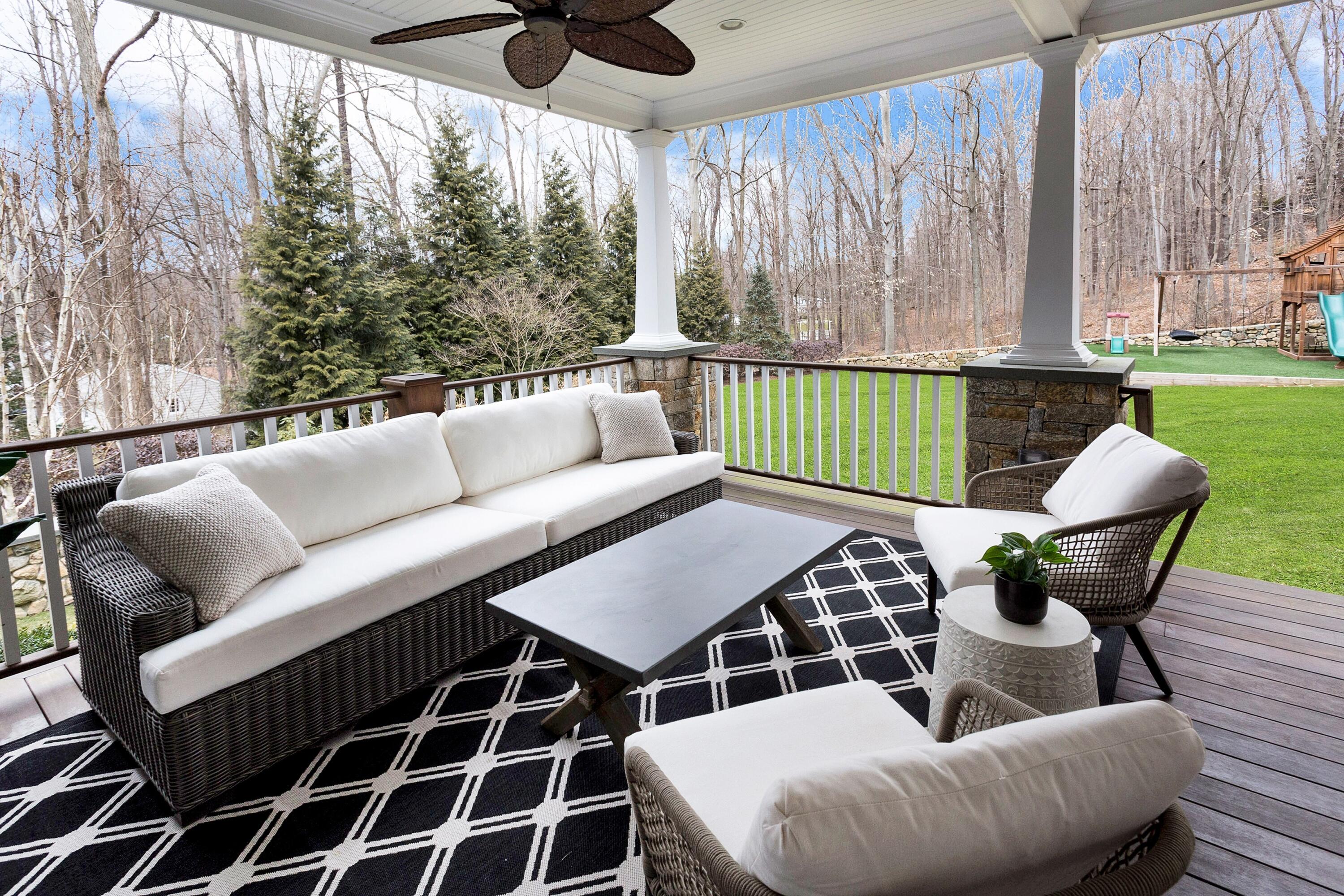 33 Briar Brae Road Darien, CT 06820 - Photo 31 of 37 a view of a patio with couches and pool