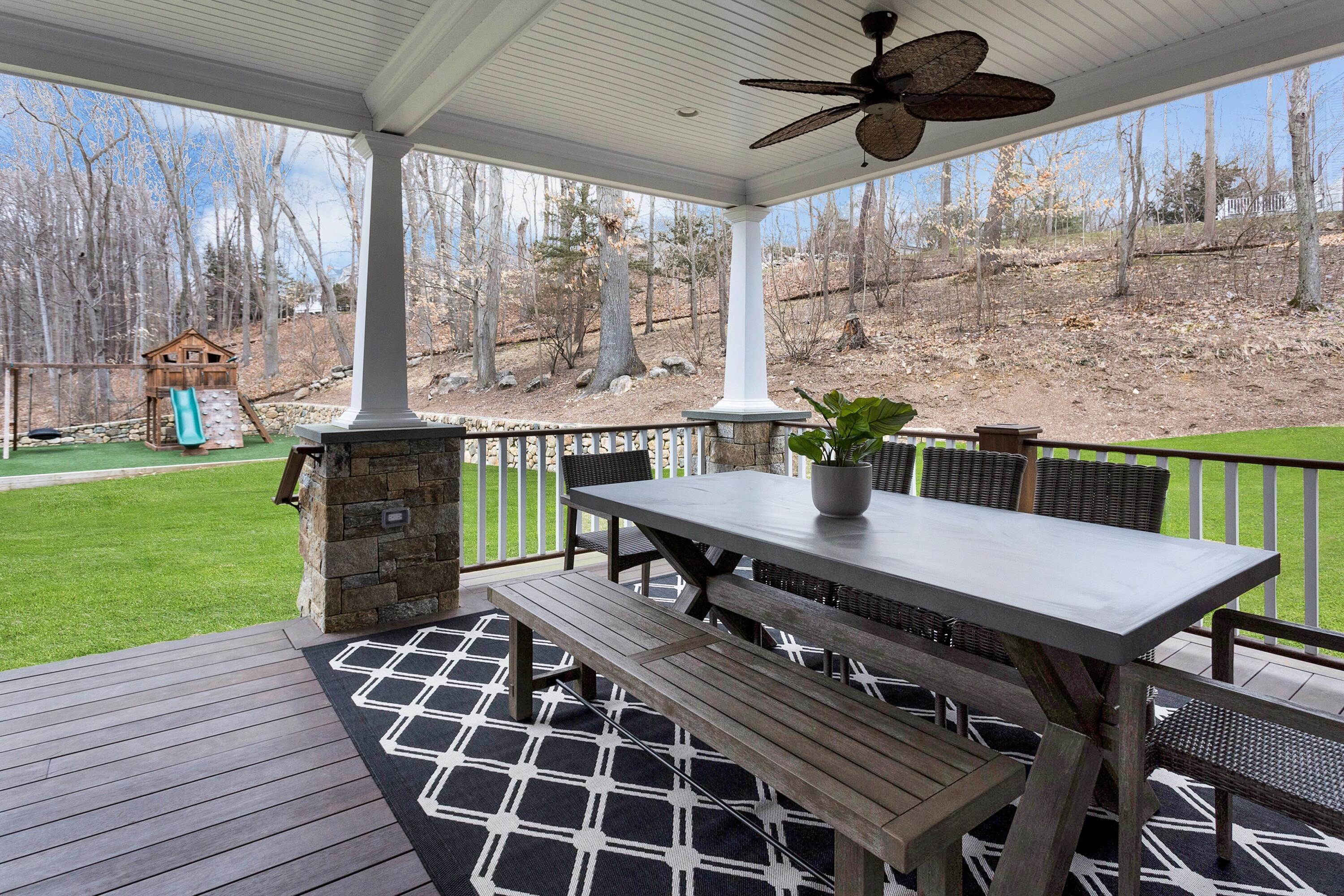 33 Briar Brae Road Darien, CT 06820 - Photo 32 of 37 a view of a patio with a table chairs and a backyard
