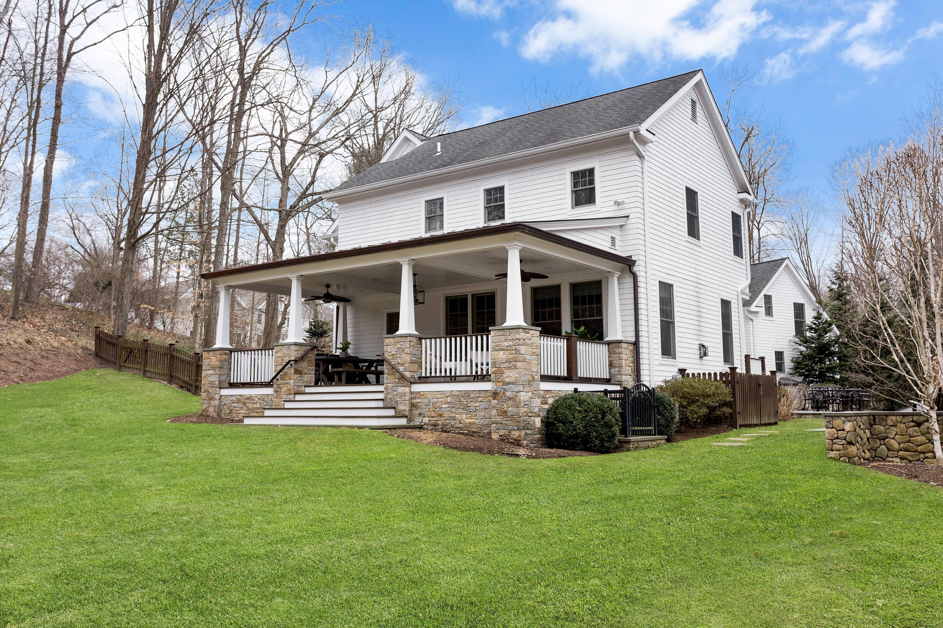 33 Briar Brae Road Darien, CT 06820 - Photo 33 of 37 a front view of a house with a garden