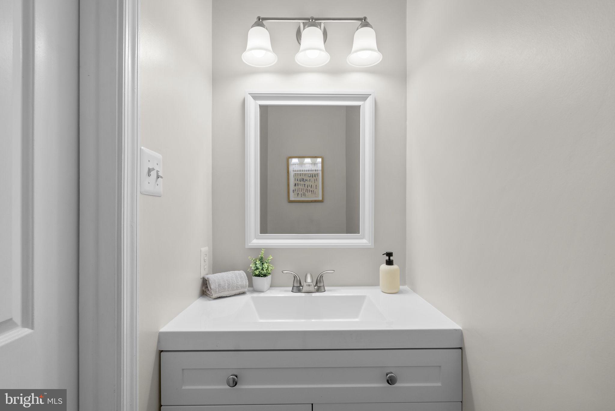 8 Seville Way Gaithersburg, MD 20878 - Photo 15 of 45 a bathroom with a sink and a mirror