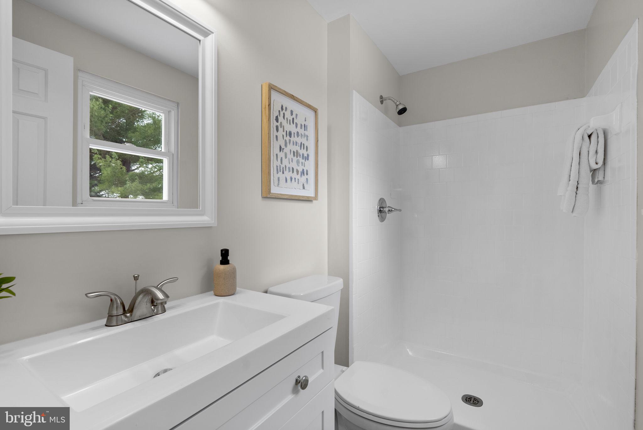 8 Seville Way Gaithersburg, MD 20878 - Photo 18 of 45 a bathroom with a sink toilet and shower