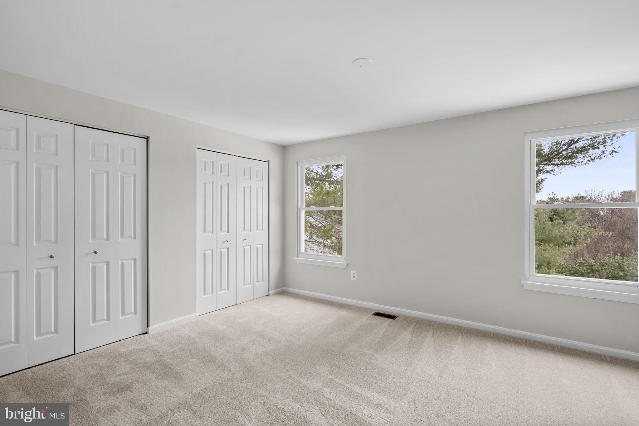 8 Seville Way Gaithersburg, MD 20878 - Photo 19 of 45 a view of an empty room with a window